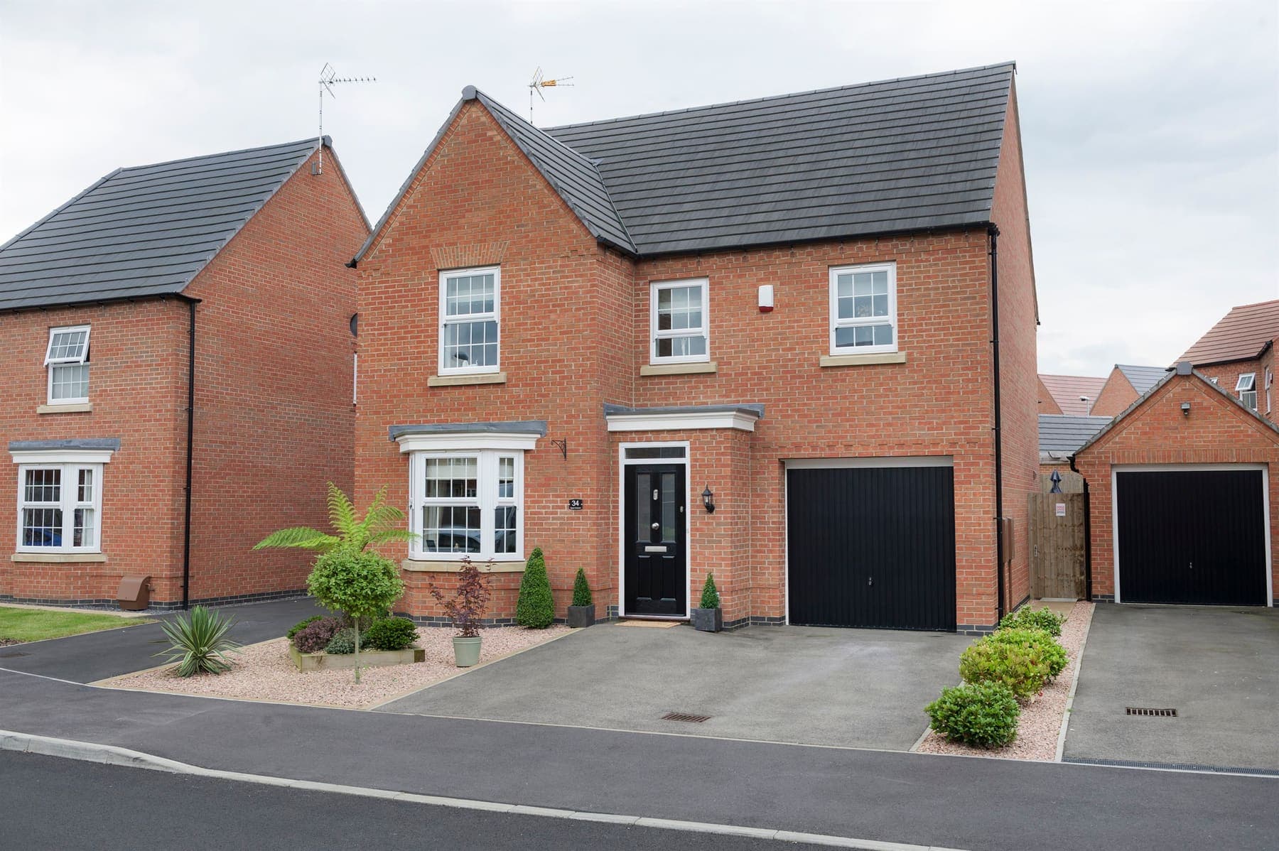 Portavelle Ashcombe composite front door in Black shown on a house